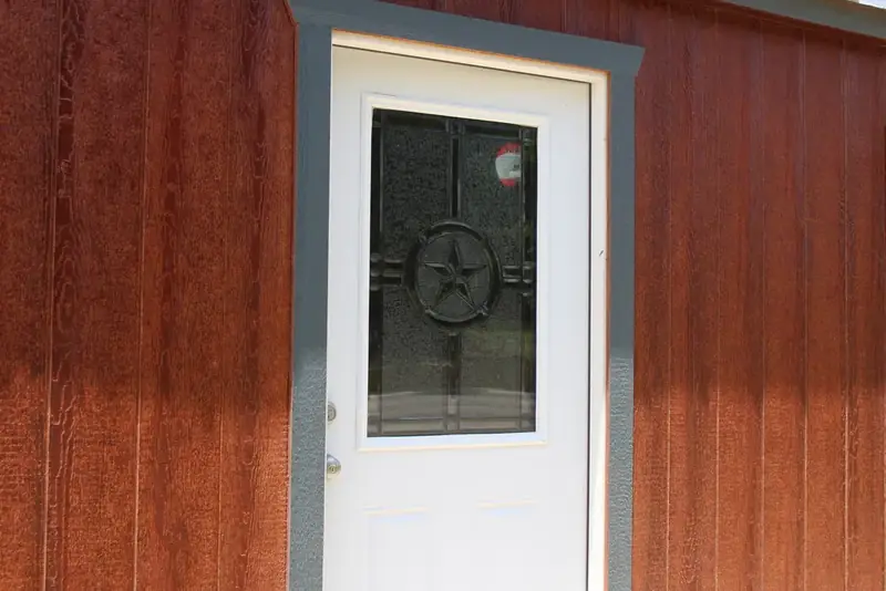16x40 Dormer Cabin Shell, door with star glass