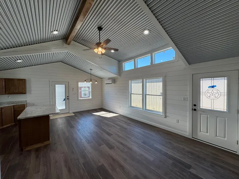 20x48 Tiny Home – Model 6327, great room with a star glass front door