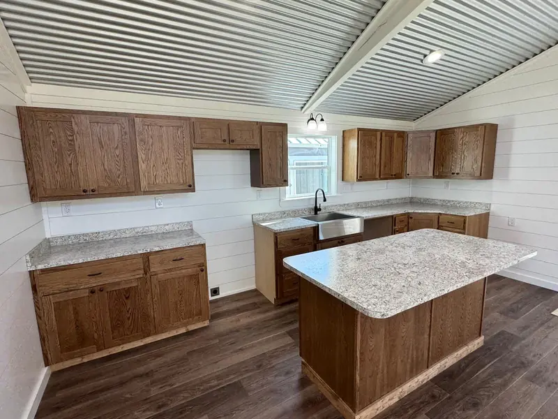 20x48 Tiny Home – Model 6327, kitchen with granite countertops