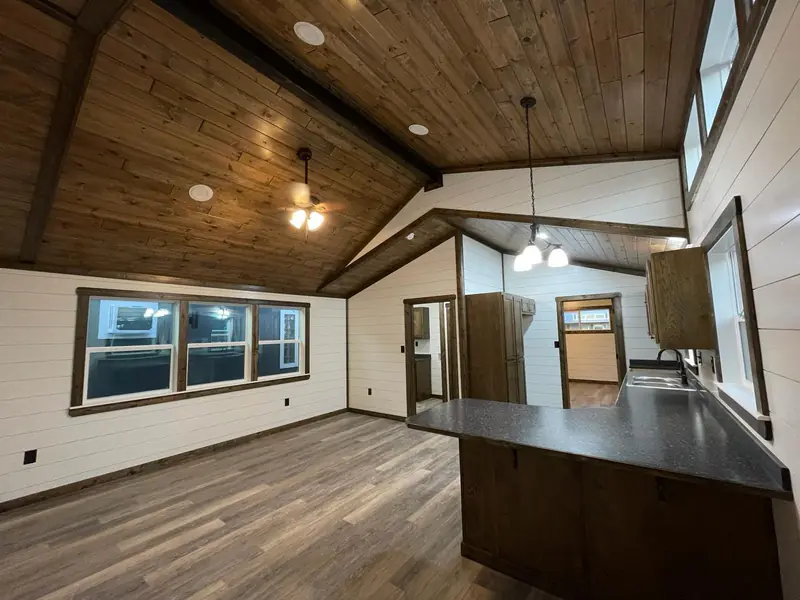 18x48 Tiny Home – Model 8068, great room with dark wood ceiling