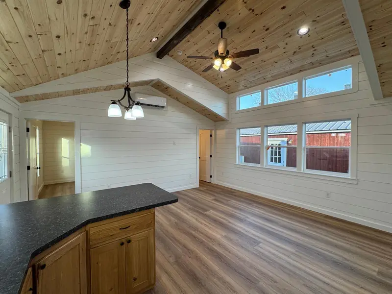 18x48 Tiny Home – Model 8068, great room with beam and island