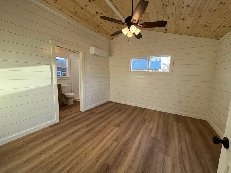 18x48 Tiny Home – Model 8068, bedroom with bath door