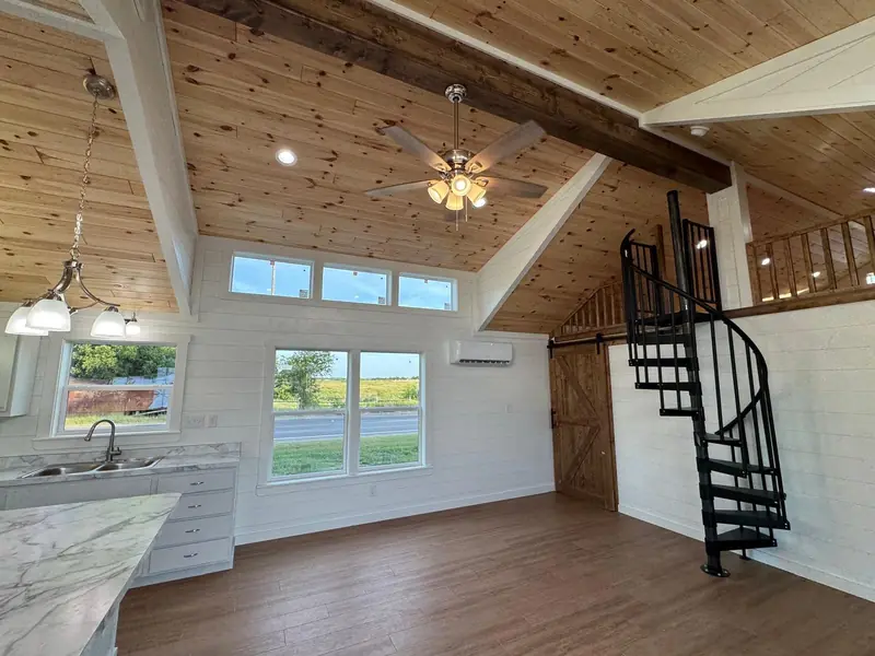 18x54 Tiny Home – Model 8530, great room with spiral staircase to the loft