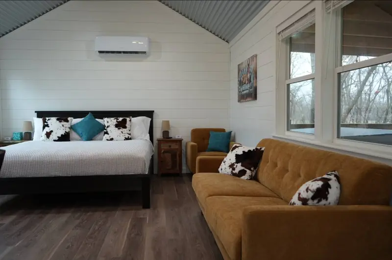 14x24 Tiny Home – Model 8701, bed and sofa