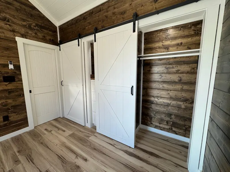 16x38 Tiny Home &ndash; Model 9487, barn door open to the closet