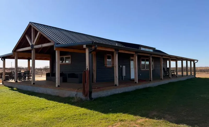 18x48 Tiny Home &ndash; Model 8068, exterior with the optional wraparound porch